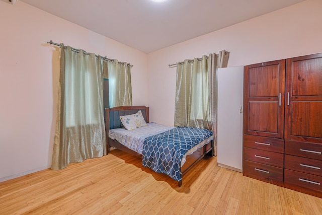 bedroom featuring light wood-type flooring