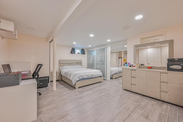 bedroom featuring light wood-style floors and recessed lighting