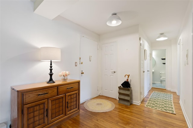 interior space with light wood-type flooring and baseboards