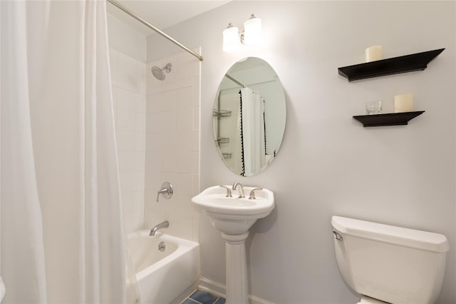 bathroom with toilet and shower / tub combo with curtain