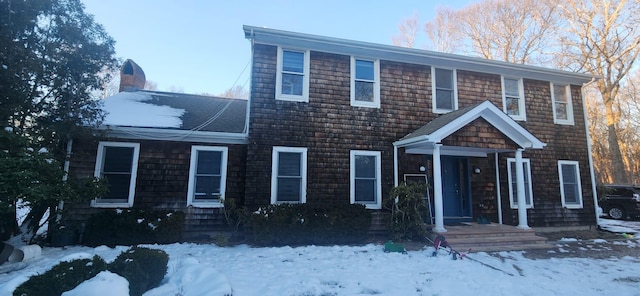 view of front of house featuring a chimney