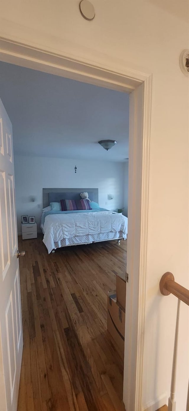 unfurnished bedroom featuring dark wood finished floors