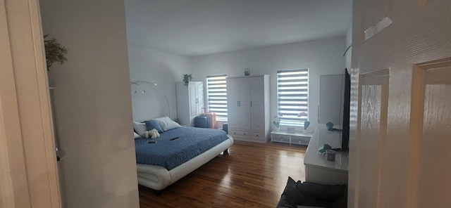 bedroom featuring wood finished floors