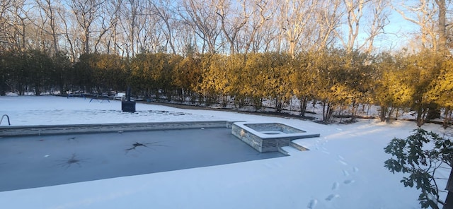 view of yard layered in snow