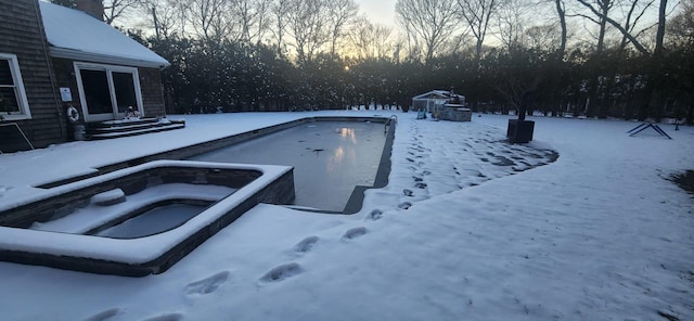 view of snow covered pool