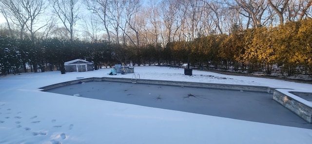 view of snow covered pool