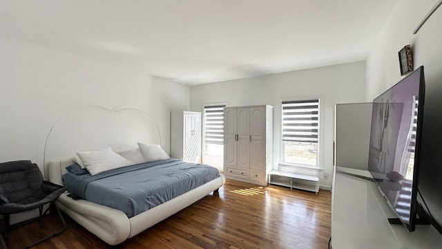 bedroom with wood finished floors