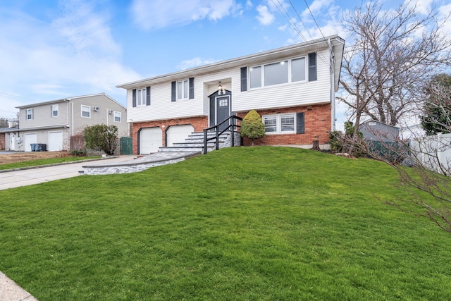 bi-level home with a garage and a front lawn