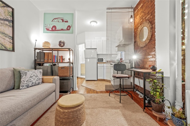 living room with light hardwood / wood-style flooring