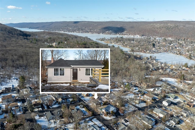 11 Oakwood Ave, Greenwood Lake, NY 10925 - view of front of property with a chimney, fence, and a mountain view