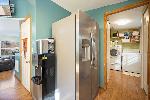 hallway featuring light hardwood / wood-style flooring and independent washer and dryer