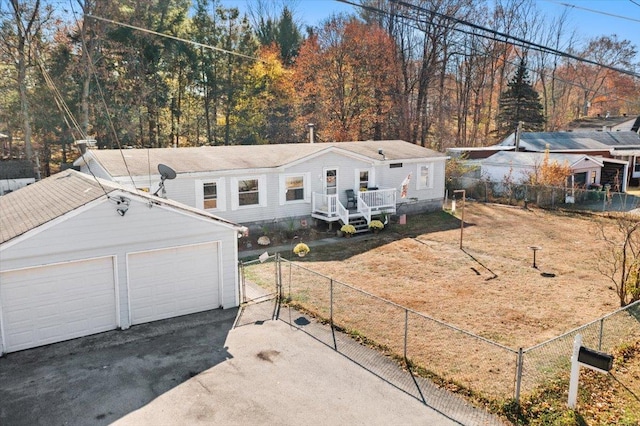 front facade featuring an outbuilding and a garage