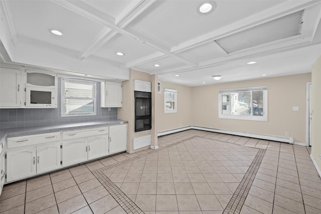 kitchen with white cabinetry, tasteful backsplash, and light tile patterned floors