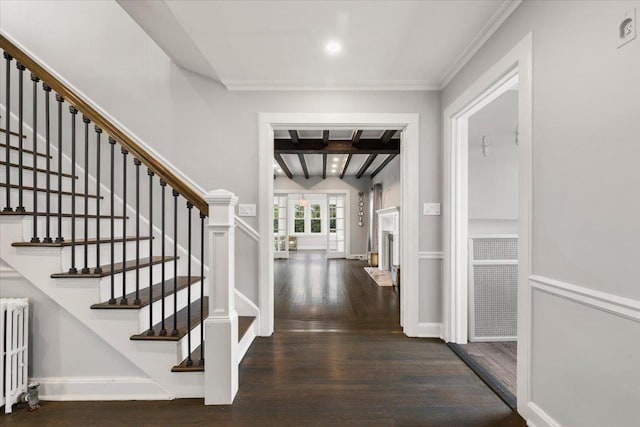 320 Putnam Ave, Port Chester, NY 10573 - entrance foyer with radiator heating unit, wood finished floors, stairway, beam ceiling, and crown molding