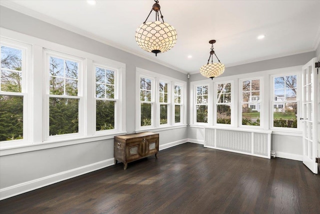 320 Putnam Ave, Port Chester, NY 10573 - unfurnished sunroom featuring radiator heating unit, baseboards, wood finished floors, ornamental molding, and recessed lighting