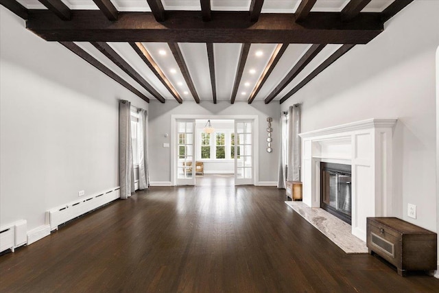 320 Putnam Ave, Port Chester, NY 10573 - unfurnished living room with a baseboard heating unit, beamed ceiling, recessed lighting, dark wood finished floors, and a fireplace
