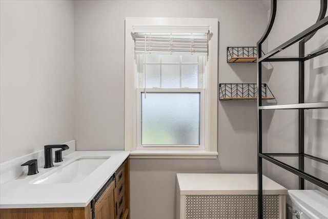 320 Putnam Ave, Port Chester, NY 10573 - half bathroom featuring plenty of natural light, toilet, and vanity