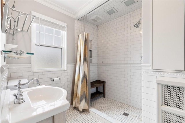 320 Putnam Ave, Port Chester, NY 10573 - full bathroom featuring a shower stall, tile walls, crown molding, a sink, and wainscoting