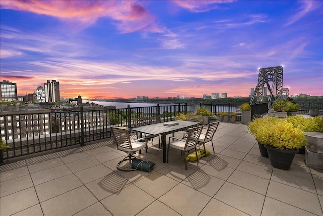 view of patio terrace at dusk