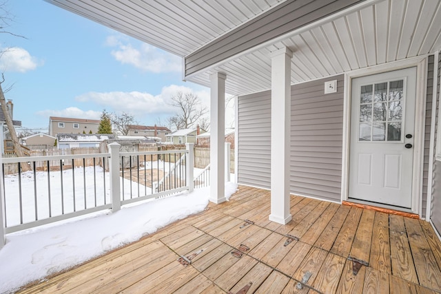 view of snow covered deck