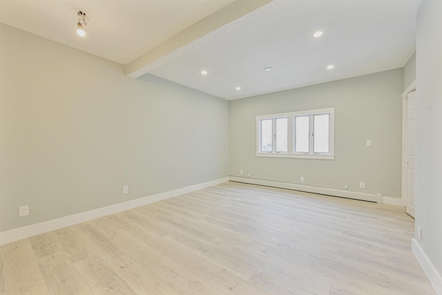 unfurnished room featuring light hardwood / wood-style flooring, beam ceiling, and a baseboard radiator