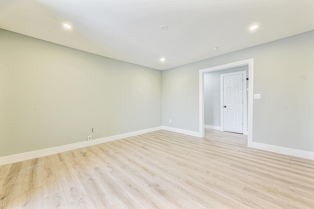 spare room featuring light hardwood / wood-style flooring