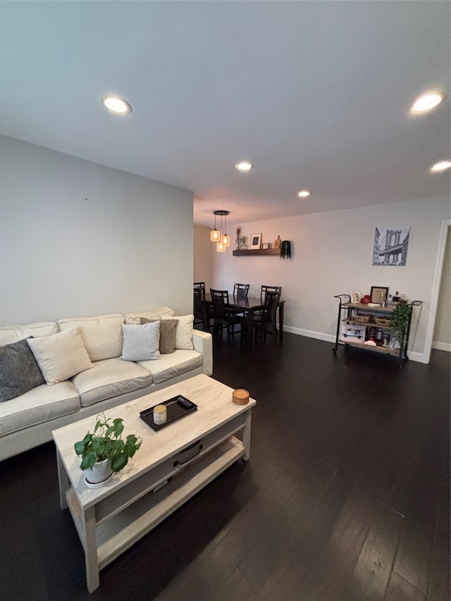 living room with dark hardwood / wood-style floors