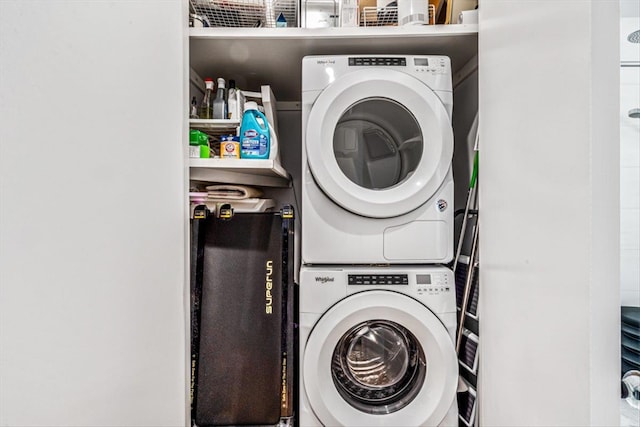 laundry area featuring stacked washer and clothes dryer