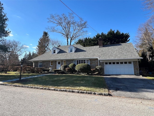 cape cod house with a garage, stone siding, aphalt driveway, and a front lawn