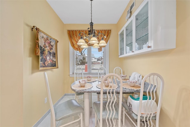 dining room with a notable chandelier