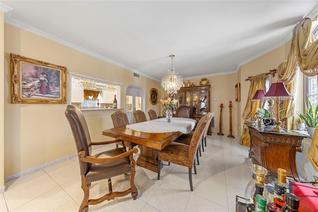 tiled dining room with ornamental molding and an inviting chandelier