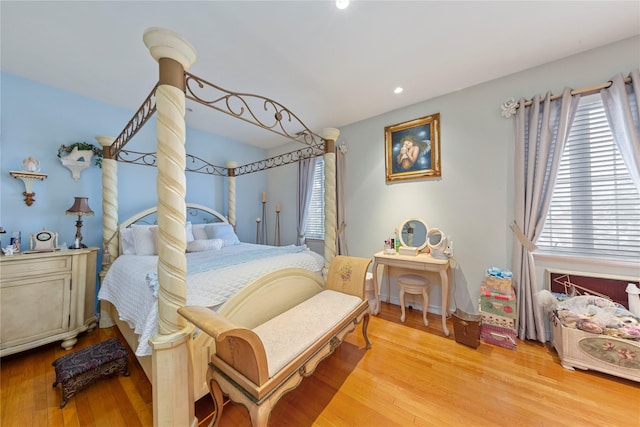 bedroom with light hardwood / wood-style flooring