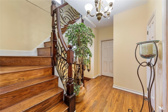 interior space featuring hardwood / wood-style floors and a chandelier