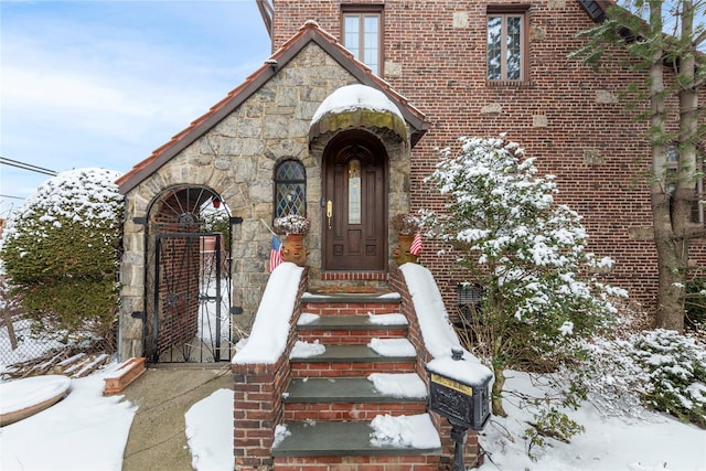 view of snow covered property entrance