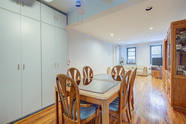 dining room featuring light hardwood / wood-style flooring and ceiling fan