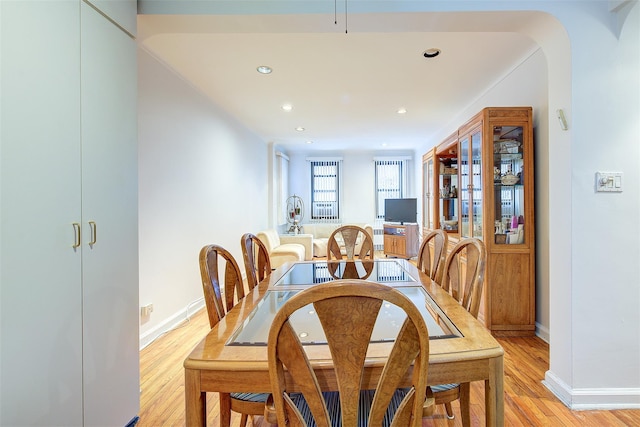 dining space with light wood-type flooring