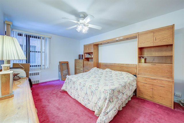 bedroom with radiator, dark carpet, and ceiling fan