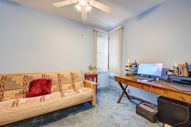 carpeted office space featuring radiator and ceiling fan