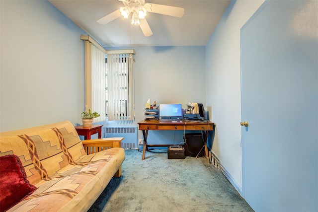 living area featuring ceiling fan, radiator, and carpet floors