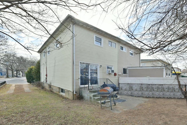 176-17 127th Ave, Jamaica, NY 11434 - rear view of property with fence and cooling unit