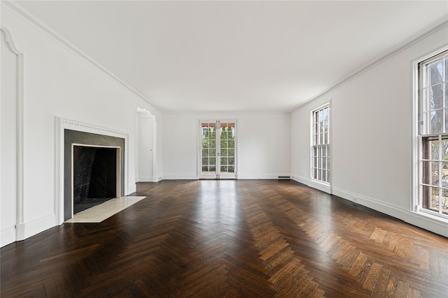 unfurnished living room with a fireplace with flush hearth, crown molding, and baseboards