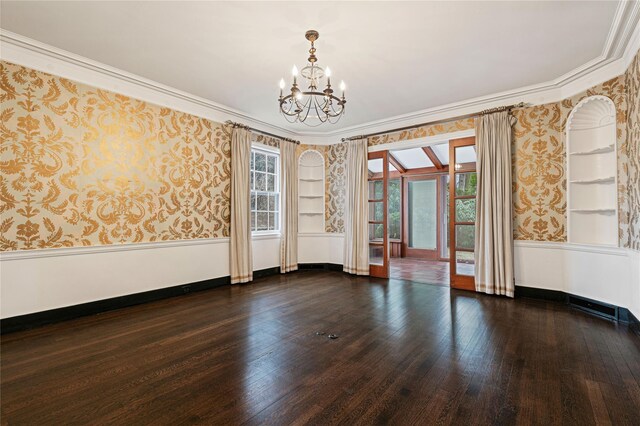 unfurnished room with plenty of natural light, hardwood / wood-style floors, and wallpapered walls