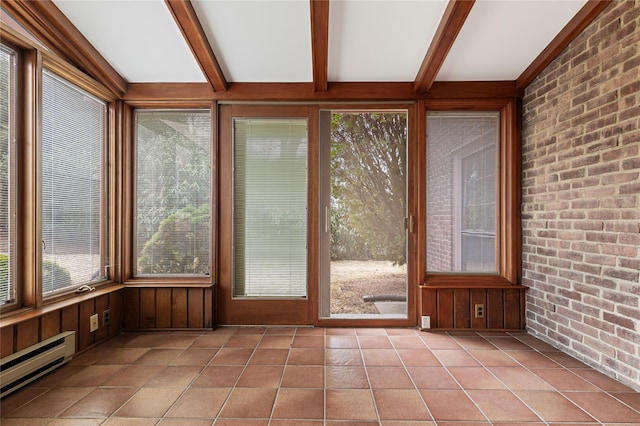 unfurnished sunroom featuring a baseboard heating unit and beamed ceiling