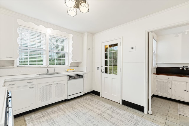 kitchen with white dishwasher, stove, a sink, white cabinetry, and ornamental molding