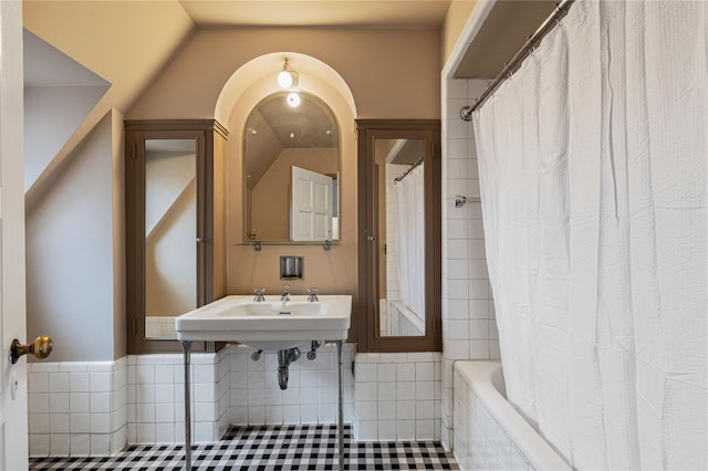 full bathroom with tile patterned flooring, a sink, and shower / bath combo