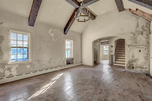 empty room with high vaulted ceiling, beamed ceiling, and a baseboard heating unit