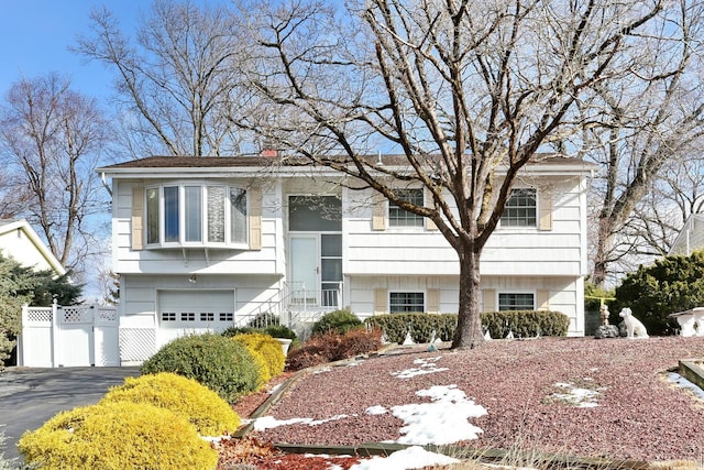 bi-level home featuring a garage