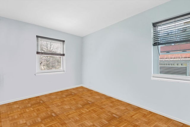 spare room featuring baseboards