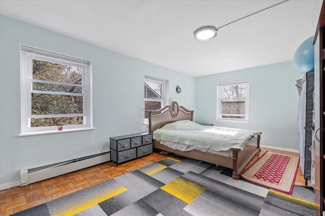 bedroom featuring baseboard heating and baseboards