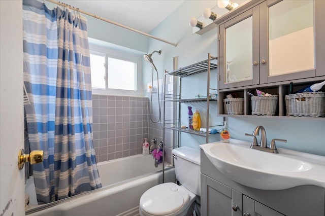 full bathroom with vanity, toilet, and shower / bath combo with shower curtain